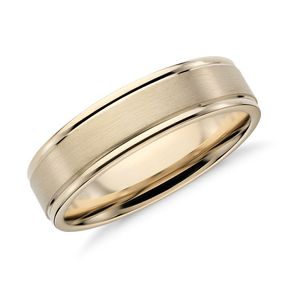 A wedding band with a brushed inlay.